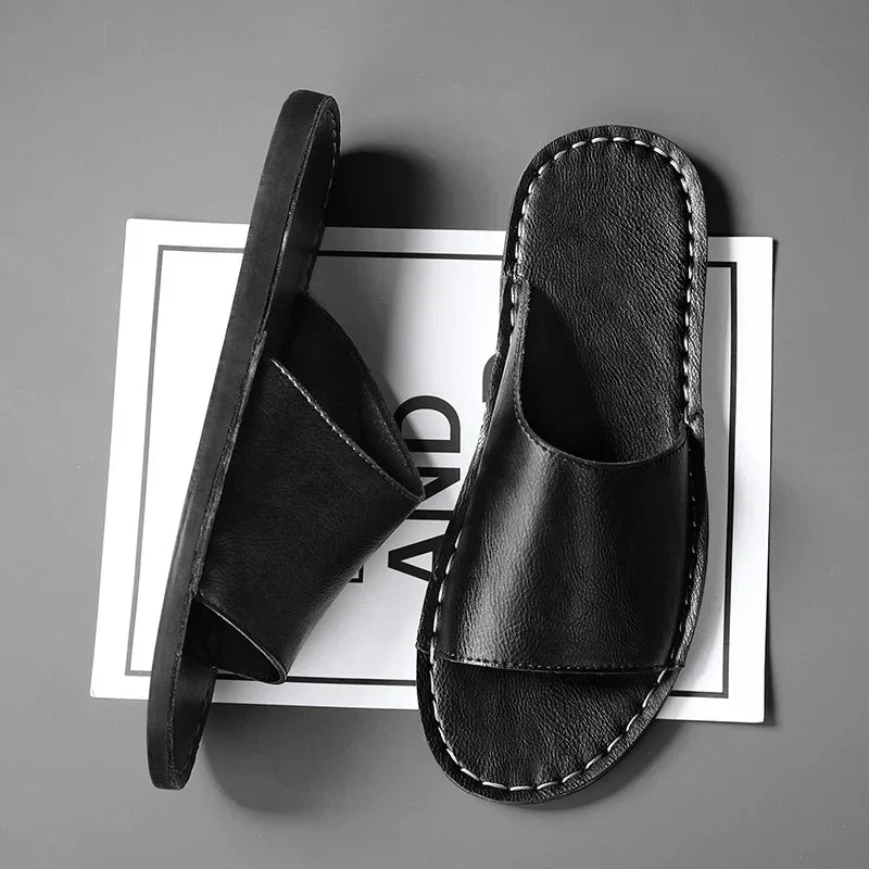 Close-up of women's comfortable stitched flat open-toe sandals. Ideal casual slip-on summer footwear.
