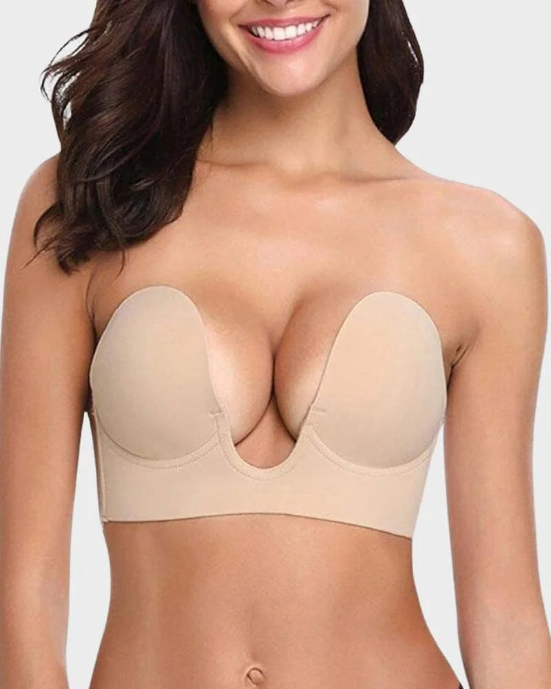 Women's strapless backless push-up bra, deep-U plunge, self-adhesive for invisible support under dresses.