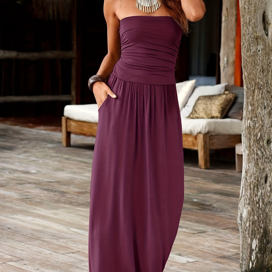 Versatile women's strapless midi dress, bandeau neckline, cinched waist, and functional pockets.