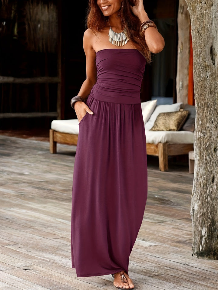 Women's evening bandeau midi dress with a sleek cinched waist & essential pockets.