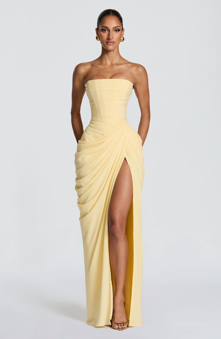 Sculpted fit strapless bodycon maxi dress, ideal for special occasions. Features a stylish corset top.