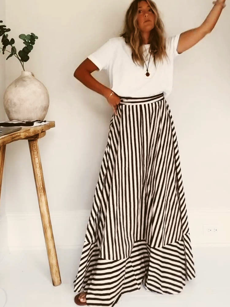 Elegant strapless maxi dress for women, featuring a chic diagonal stripe pattern & flared hem.