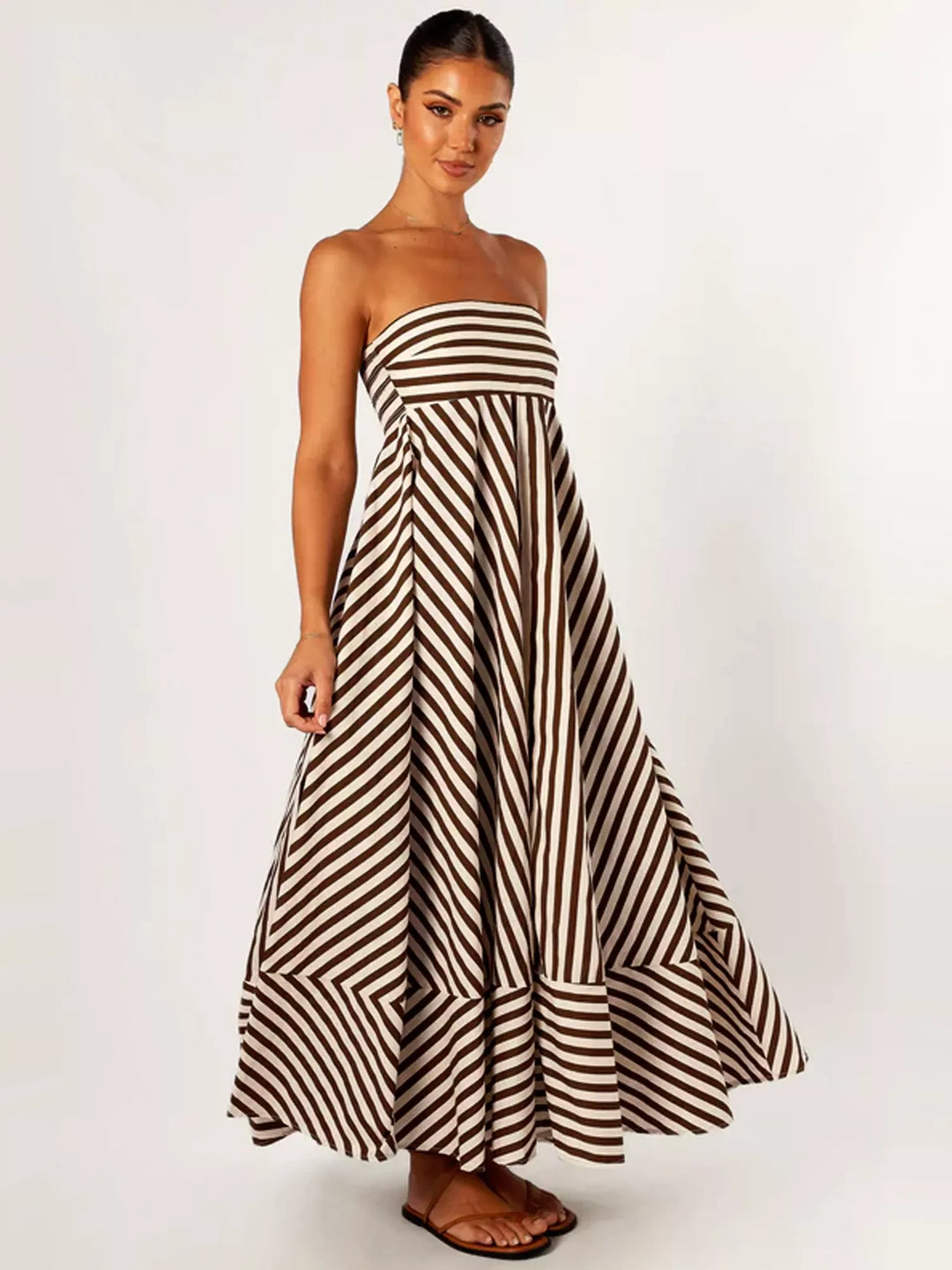 Women's strapless diagonal striped maxi dress. Flared and elegant, great for summer fashion.