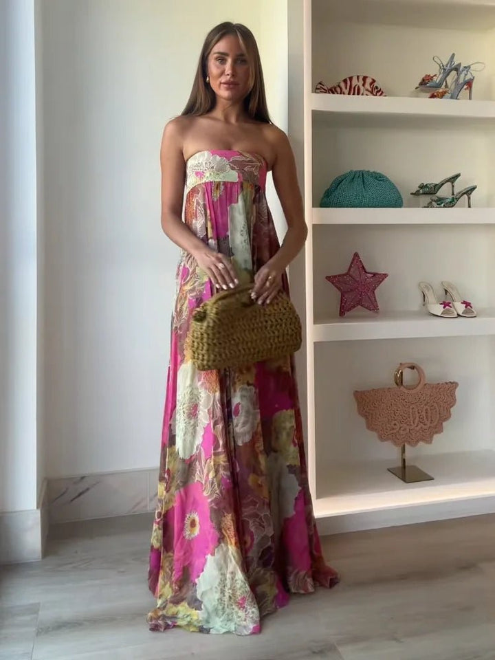 Feminine strapless floral print evening gown, a chic maxi dress for wedding guests, parties, or special occasions.