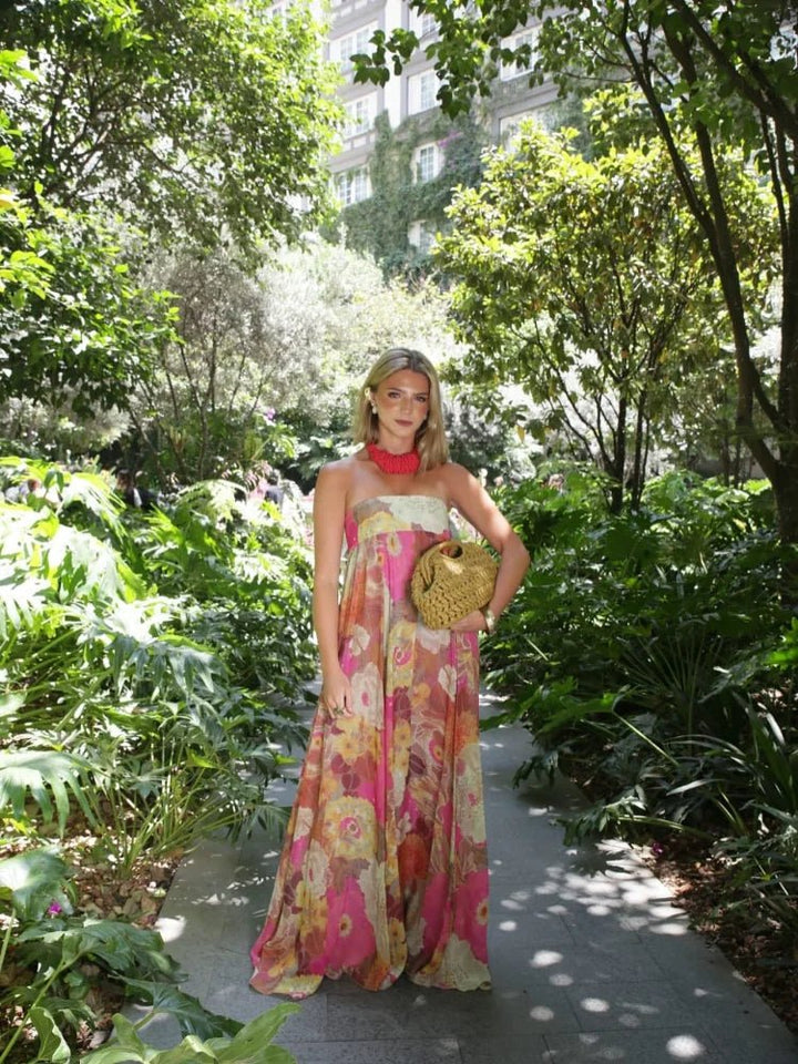Strapless floral print maxi dress for women. Elegant wedding guest attire, ideal for formal summer parties.