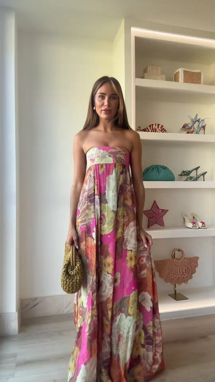 Chic women's strapless maxi wedding guest dress with a vibrant floral print, suitable for evening & special occasions.