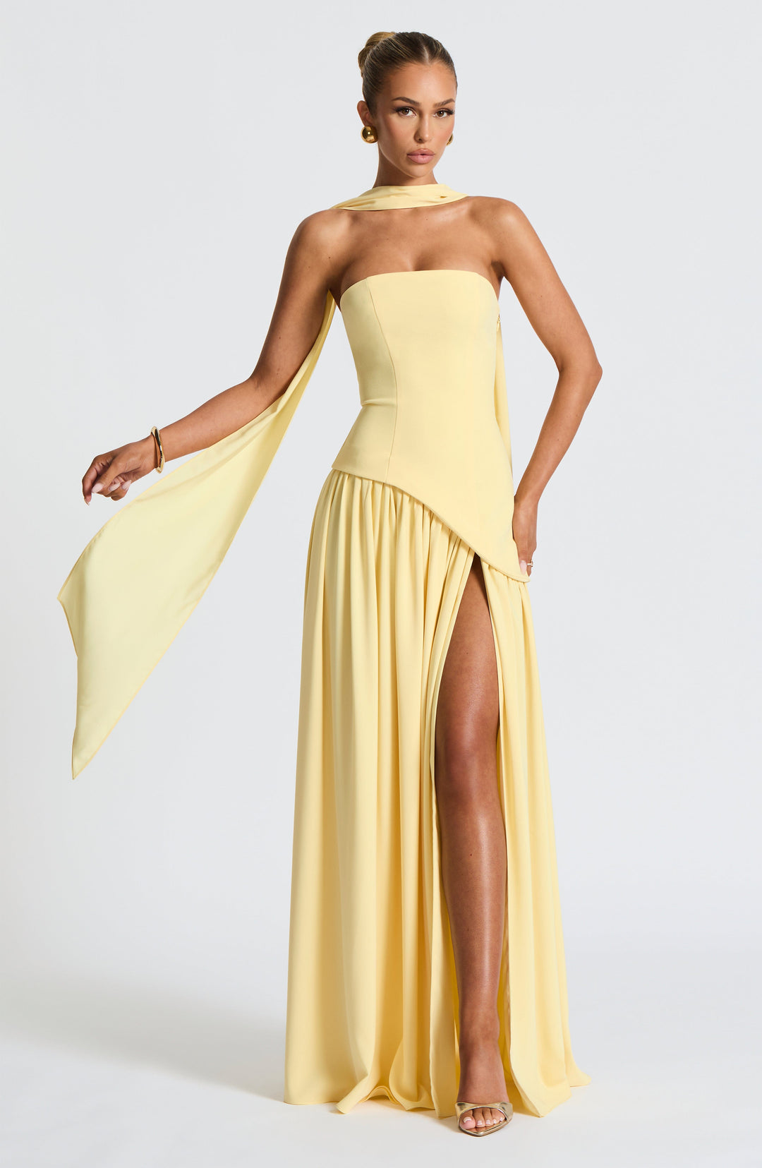 Flowy strapless maxi dress, elegant high slit & asymmetric waist. Perfect women's formal or party attire.