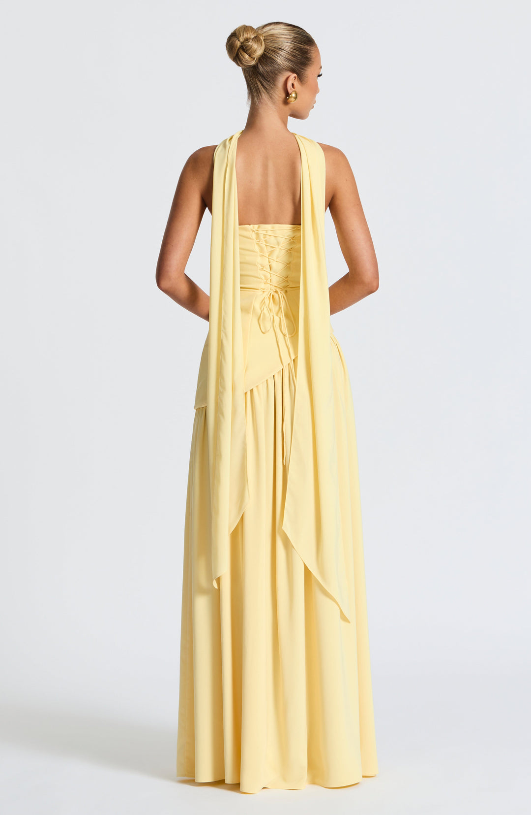 Women's elegant strapless maxi dress, high leg slit, & unique asymmetric waist for special events.