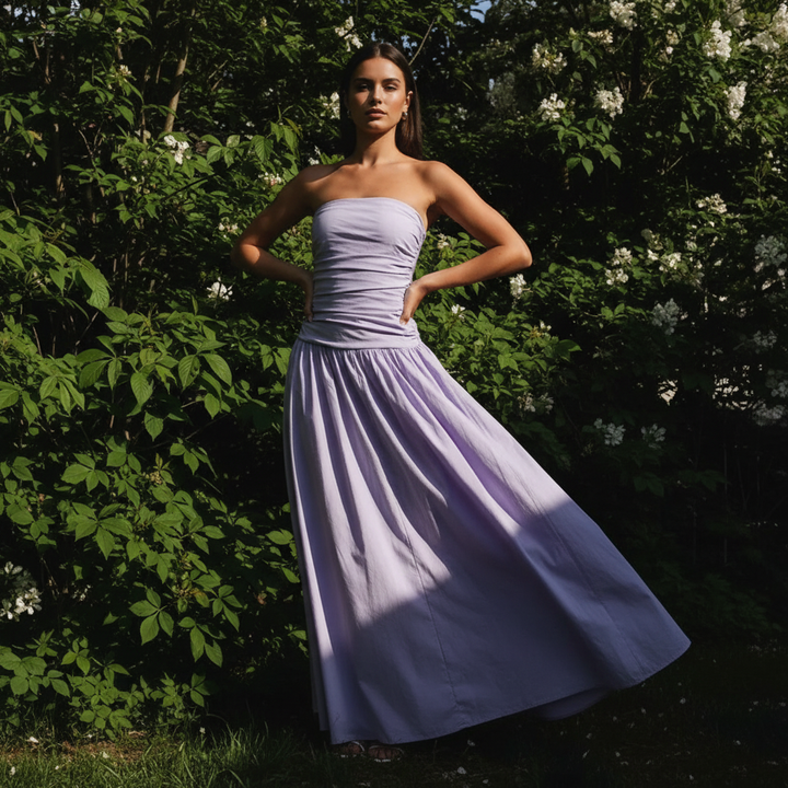 Back view of a women's long strapless summer dress, perfect for casual or evening wear.