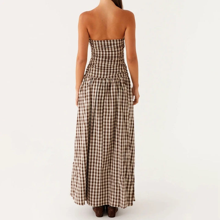 Model in an elegant strapless maxi dress, perfect long summer evening wear for women.