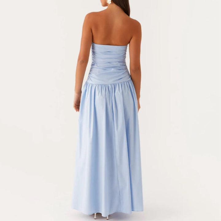 Flowing movement of a women's strapless summer maxi dress, elegant, comfortable, and chic.