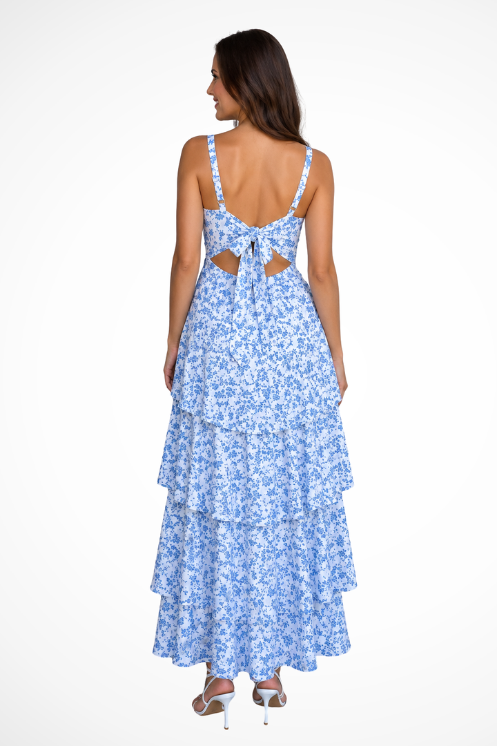 Women's floral strappy maxi dress with elegant tiered ruffles. A beautiful long party dress for wedding guests.