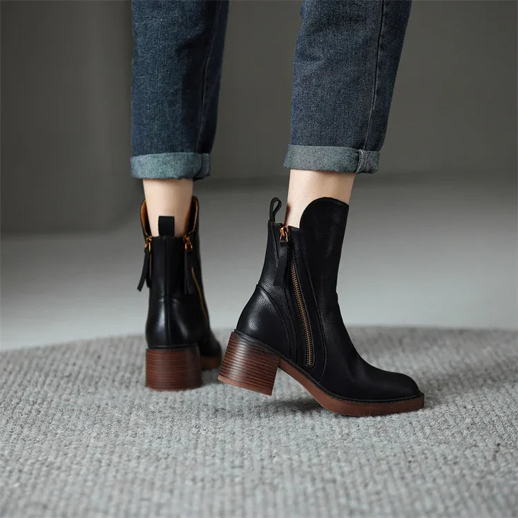 Comfortable black ankle boots for women, offering a streamlined look and effortless wear for any occasion.