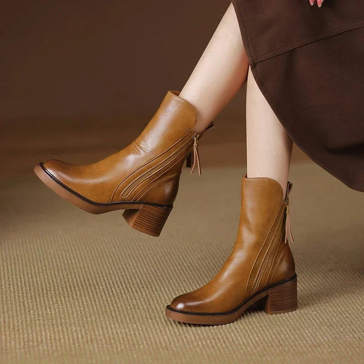 Streamlined black ankle boots for women, blending fashion and effortless comfort. Ideal versatile footwear.