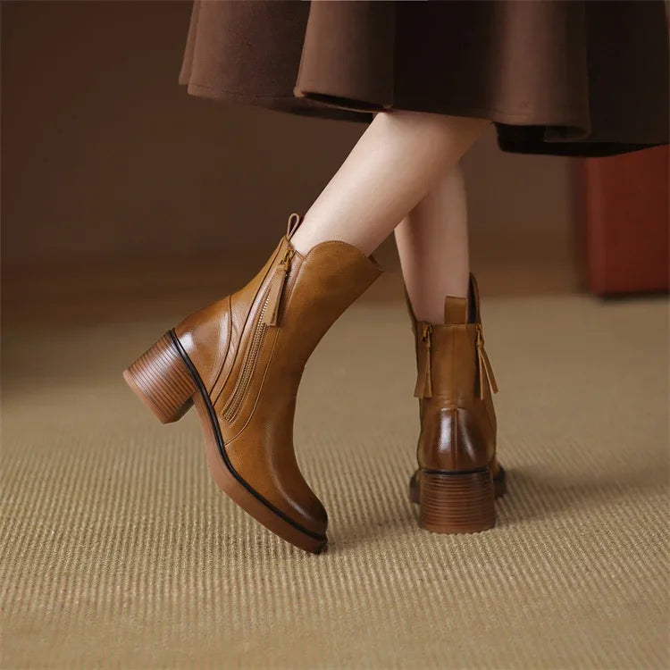 Women's comfortable brown ankle boots with a streamlined design, perfect for elegant everyday wear.