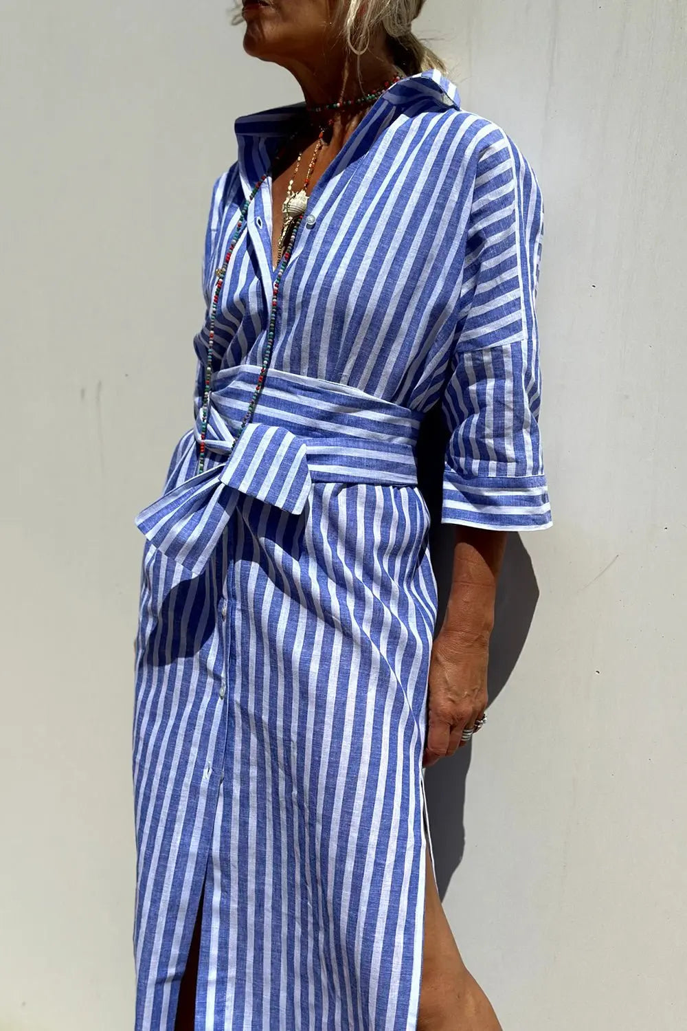 Relaxed fit women's striped button-down midi dress, a comfortable collared shirt dress for everyday casual style.