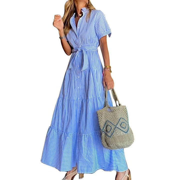 Fashionable women's striped tiered maxi dress with functional button-down front, polo collar, and tie-waist.