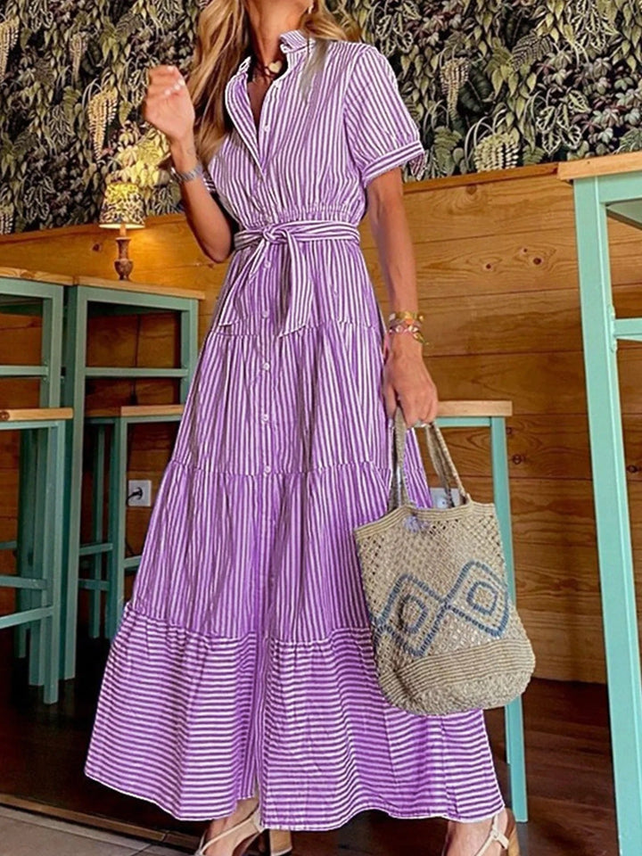 Versatile women's casual striped button-down tiered maxi dress. Features polo collar, tie-waist & A-line.