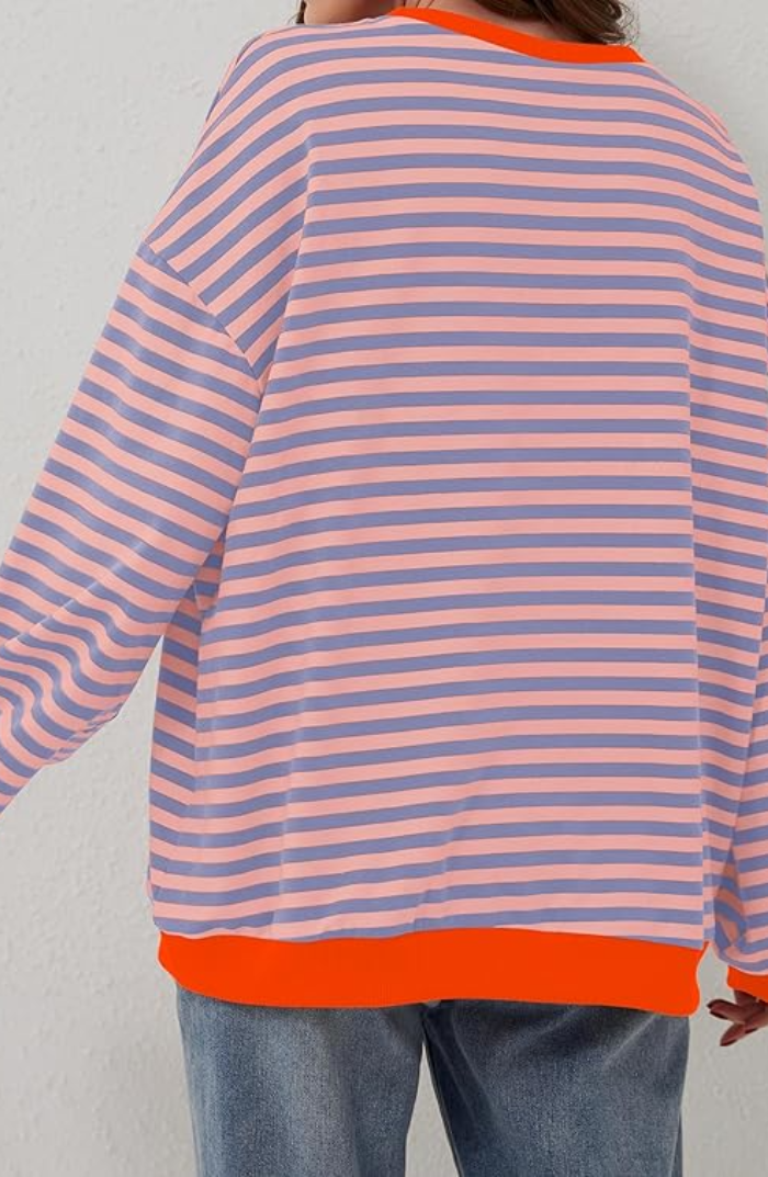 Cozy women's striped crewneck sweater, perfect for layering and creating comfortable, chic outfits.