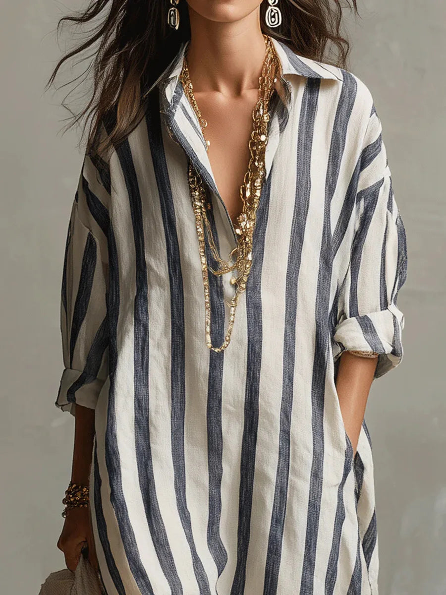 Elegant women's striped midi shirt dress with a flattering V-neck, flowy skirt, and practical three-quarter sleeves.