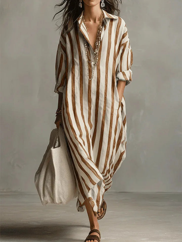 Stylish striped midi shirt dress for women, with a comfortable flowy fit, V-neck, and practical three-quarter sleeves.