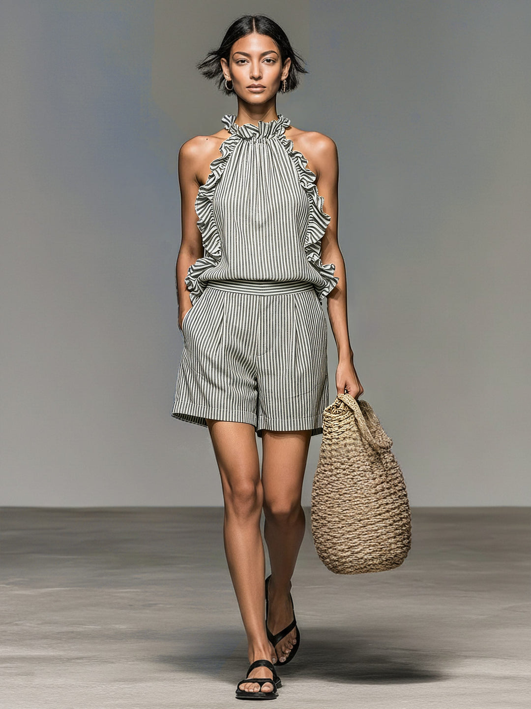Stylish women's two-piece striped halter shorts set. Ideal summer resort wear with playful ruffle details, casual chic.