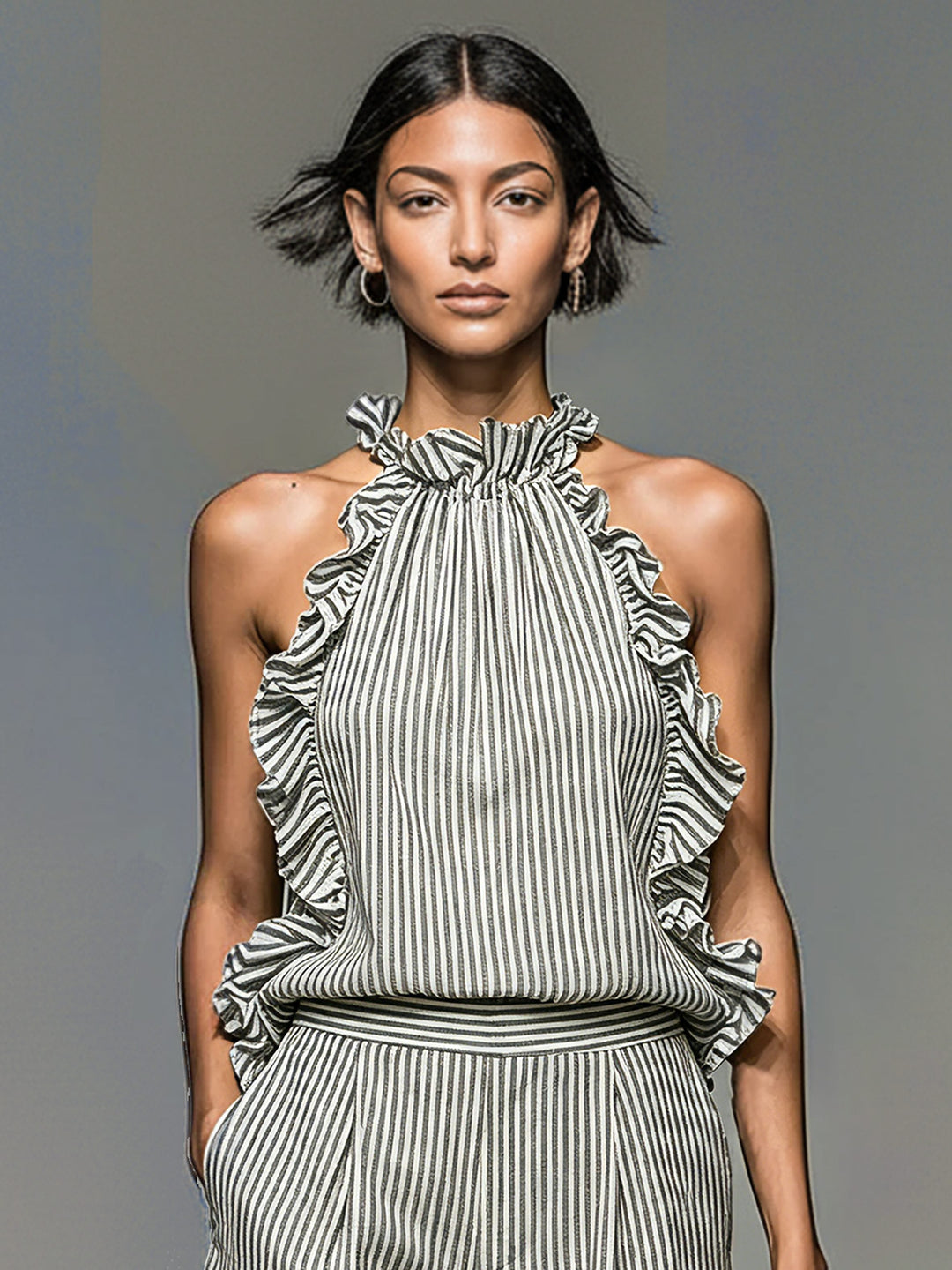 Striped halter top and matching ruffle shorts set for women. A fashionable co-ord summer outfit, perfect for warm weather.