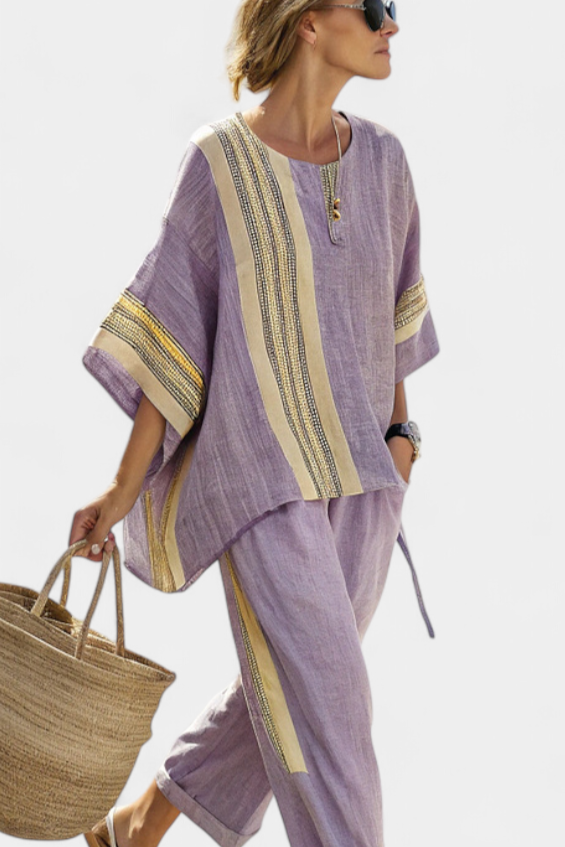 Relaxed fit women's striped linen tunic and capri set, offering comfort and style for summer.