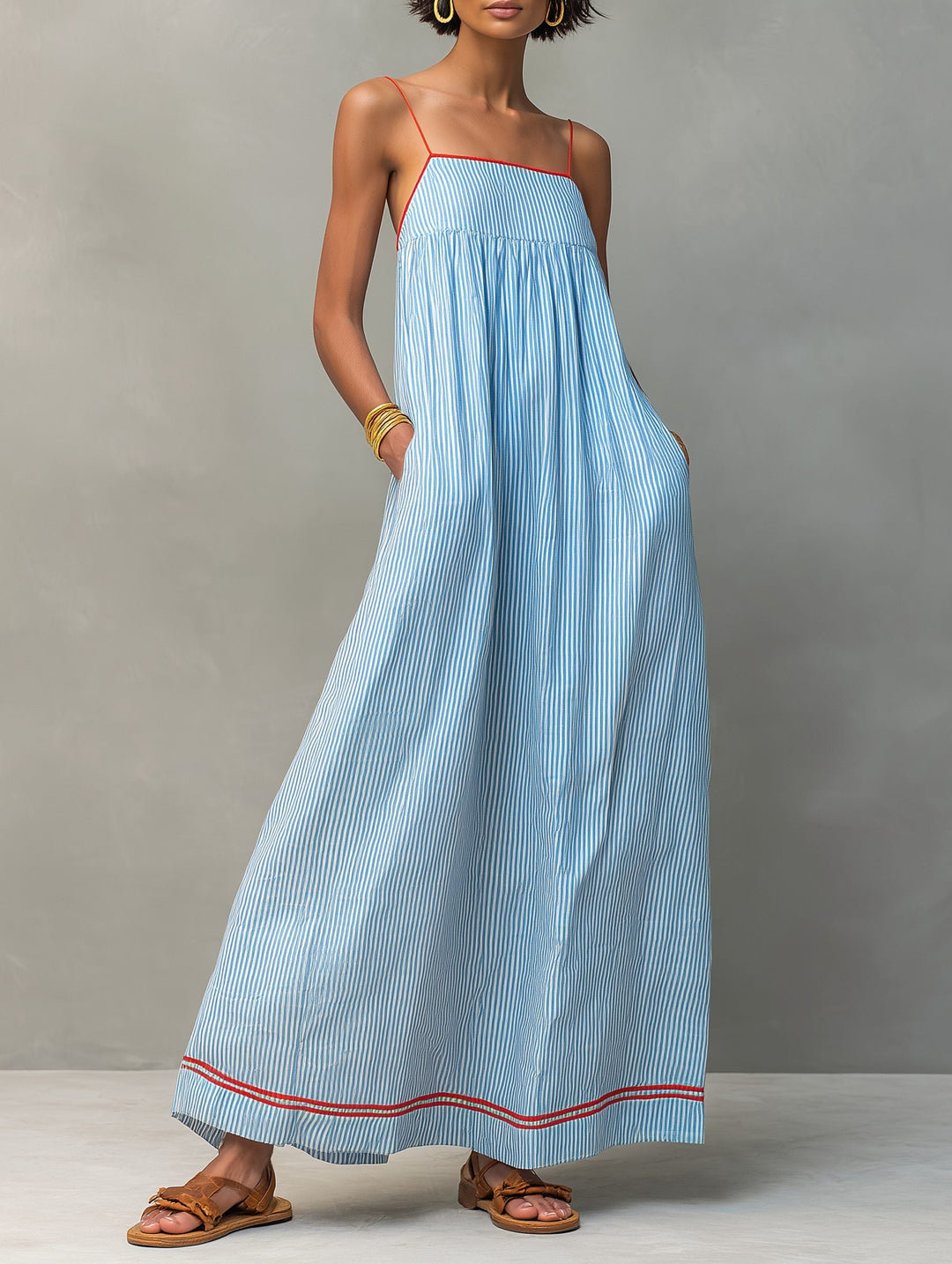 Chic striped sleeveless maxi dress with pockets, an everyday essential for summer style.