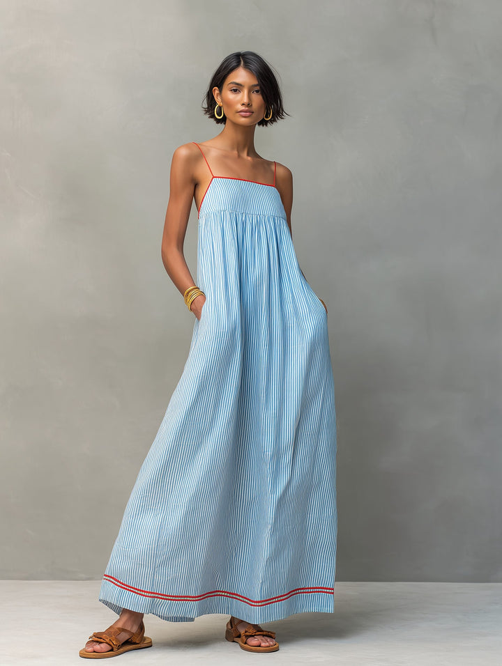 Sleeveless striped maxi dress featuring handy side pockets. Ideal for summer casual wear.