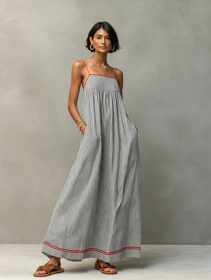 Flowy striped maxi dress, great for beach, resort, or relaxed summer days.