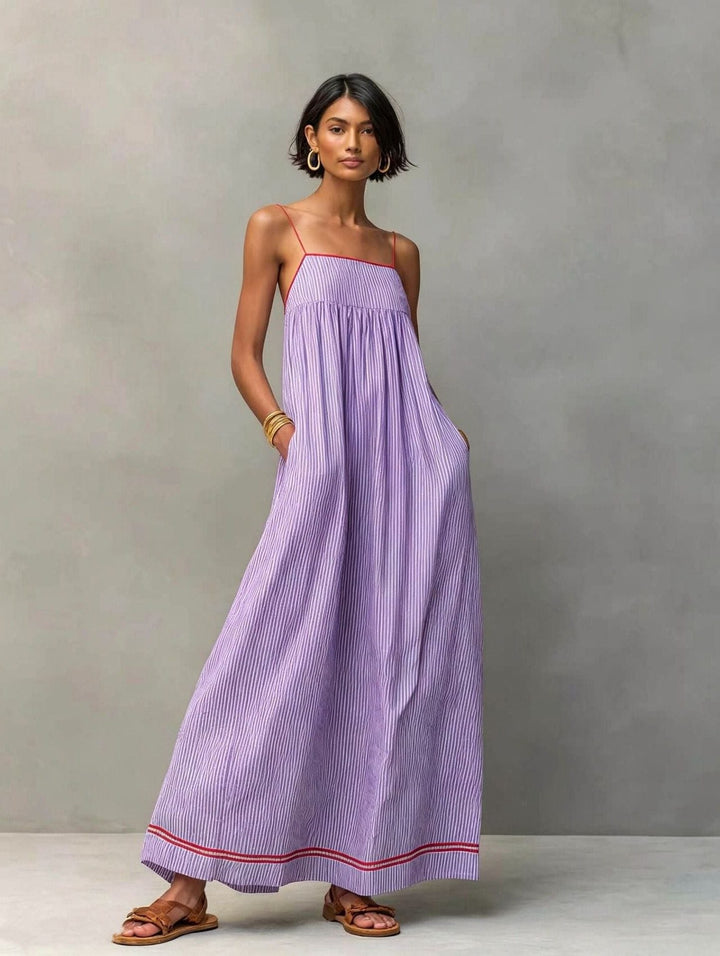 Versatile striped maxi dress with pockets, great for casual outings & resort wear.