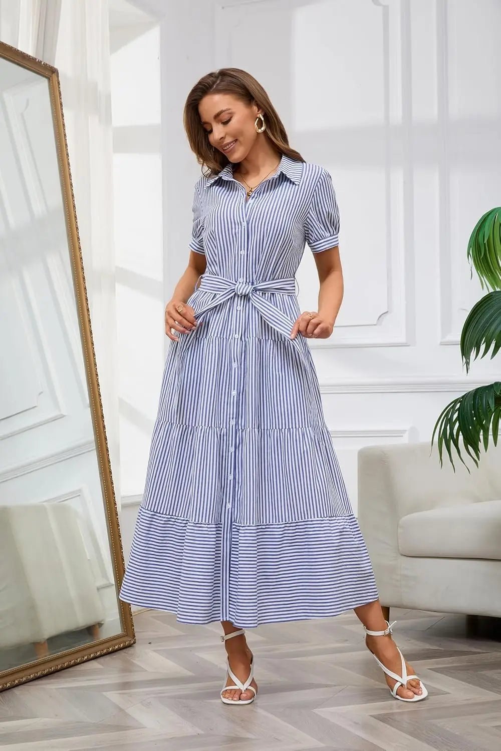 Elegant daywear: long striped dress for women, featuring ruffles, a tie waist, and button-down style.