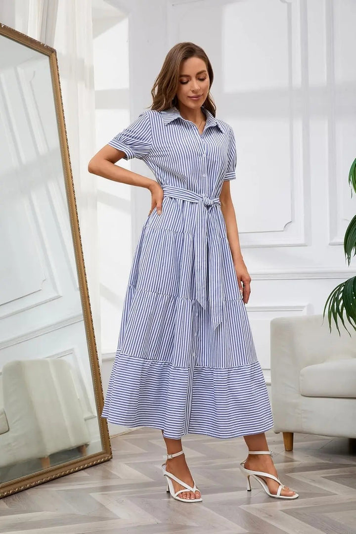 Versatile women's striped maxi dress, button-down, with a flattering tie-waist and ruffle accents.