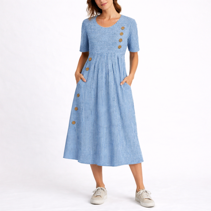 Women's striped midi dress with practical pockets. Flattering fit and flare, perfect for casual summer wear.