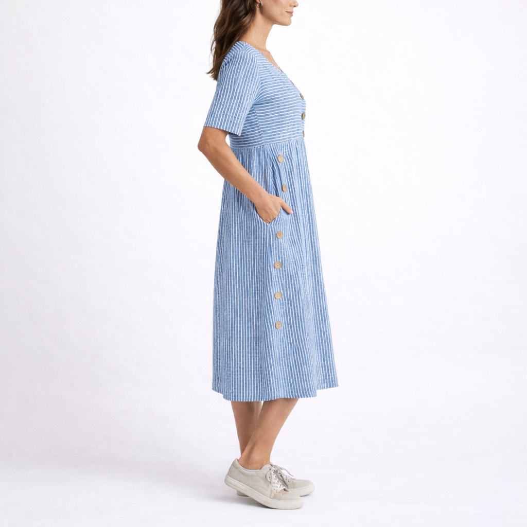 Comfortable women's striped midi dress with scoop neck, short sleeves, and pockets. Ideal for spring fashion.