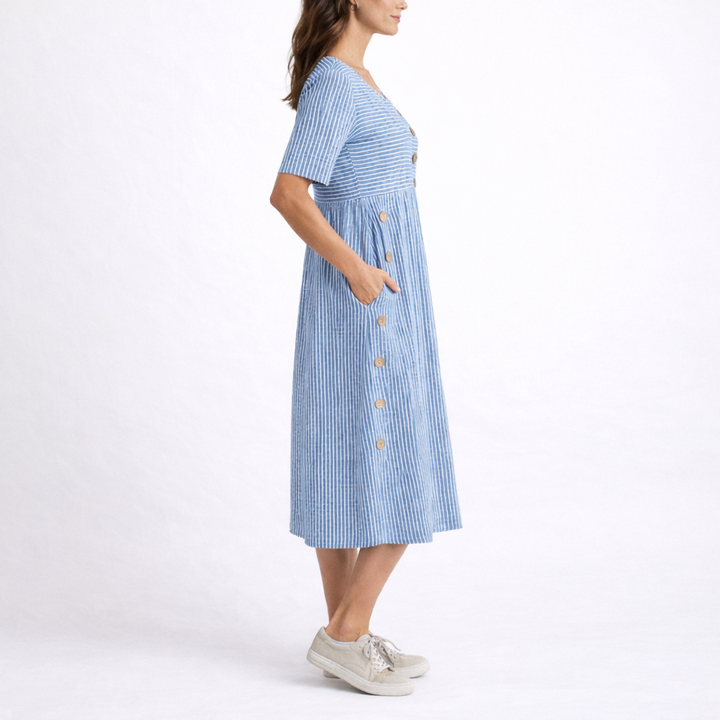 Comfortable women's striped midi dress with scoop neck, short sleeves, and pockets. Ideal for spring fashion.