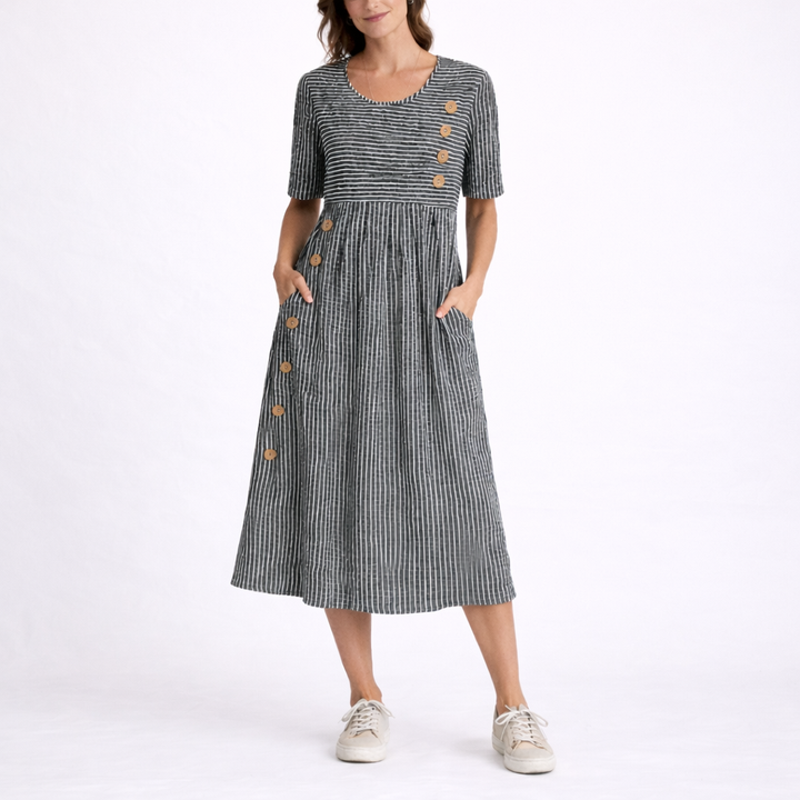 Casual women's striped midi dress with pockets. Comfortable short sleeve, scoop neck design for everyday spring style.