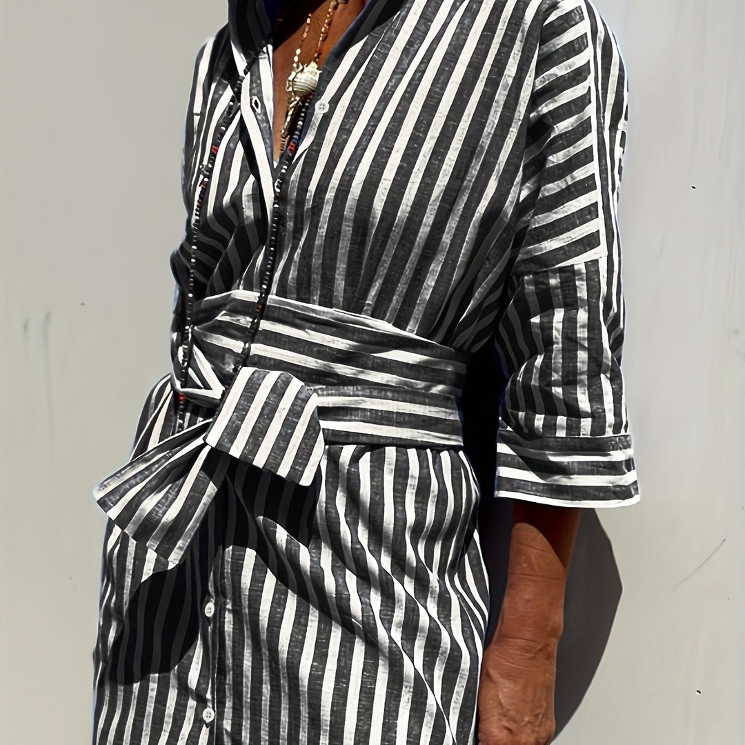 Women's belted striped dress with chic buttons & comfortable three-quarter sleeves.