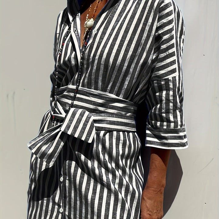 Women's belted striped dress with chic buttons & comfortable three-quarter sleeves.