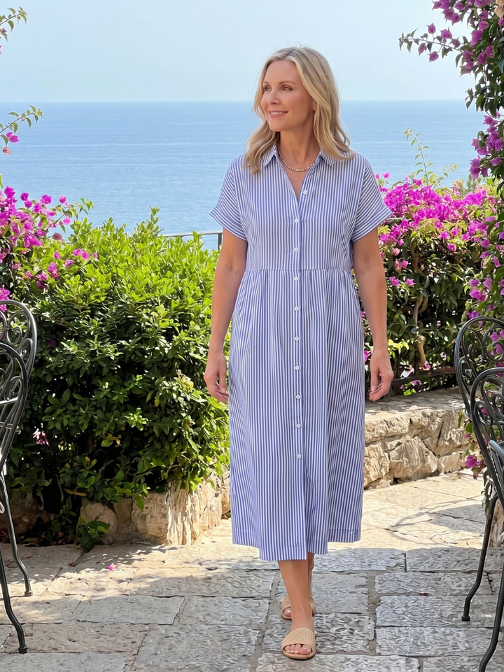 Comfortable striped short sleeve midi dress for women. Features a relaxed fit, collared design & front buttons.