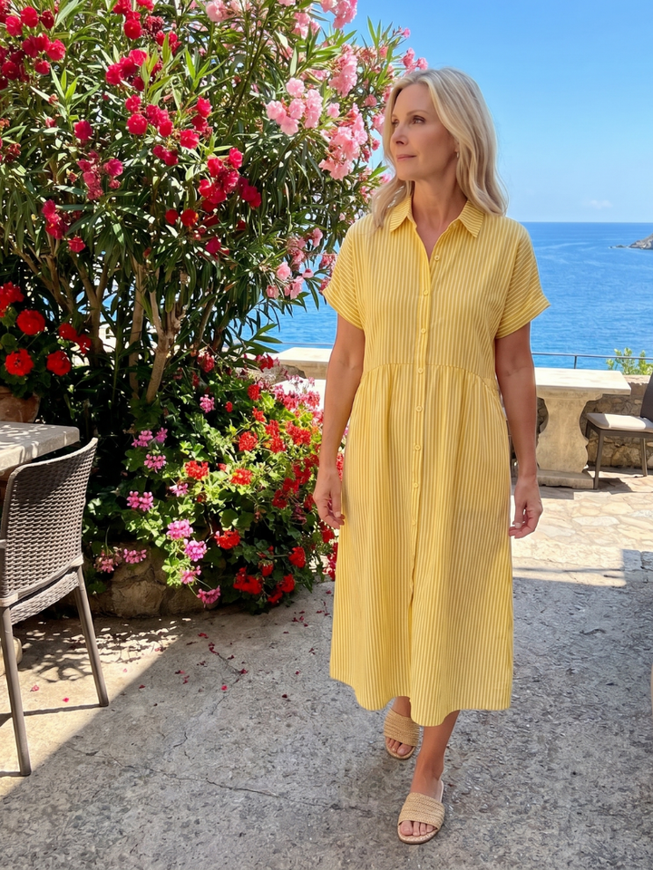 Relaxed fit women's striped midi dress, short sleeve, collared, and button-front. Great for casual spring style.