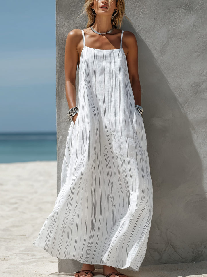 Women's striped sleeveless maxi dress for summer fashion. Flowing beachwear, perfect for vacation or casual style.