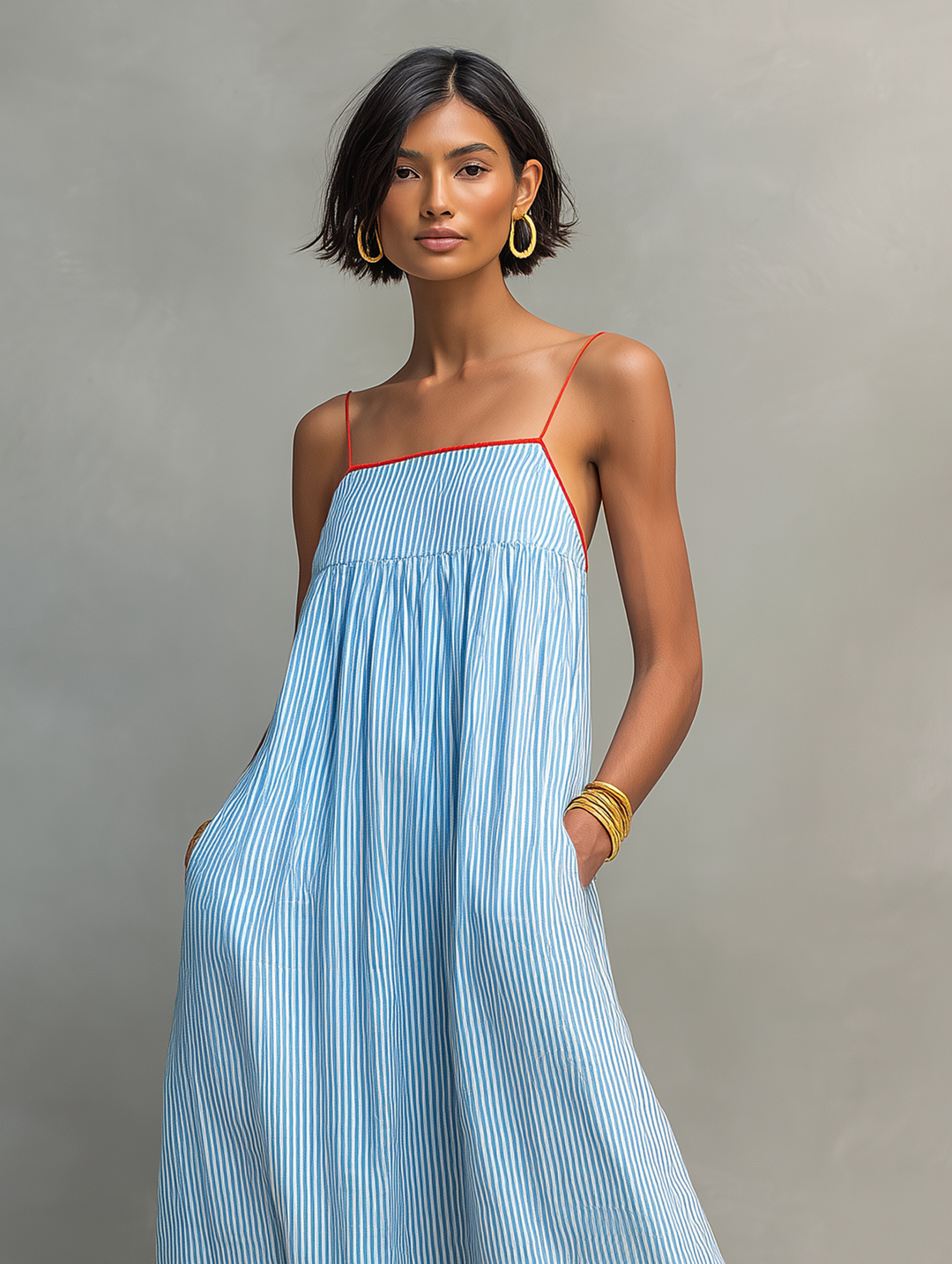 Versatile women's striped maxi dress with spaghetti straps & gathered detail, suitable for day or evening.