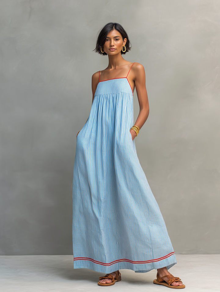Fashionable women's striped sleeveless maxi dress, designed with a flattering gathered detail for modern style.