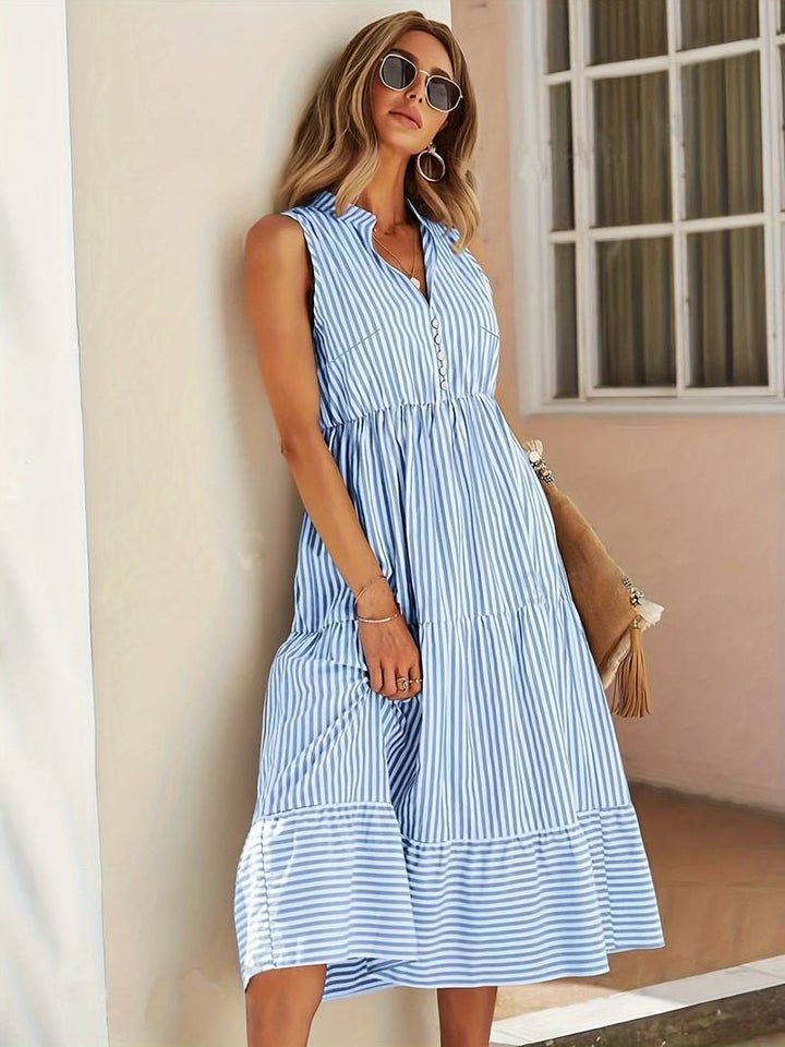 Flowing striped sleeveless midi dress for women. Ideal casual summer fashion & beach outings.