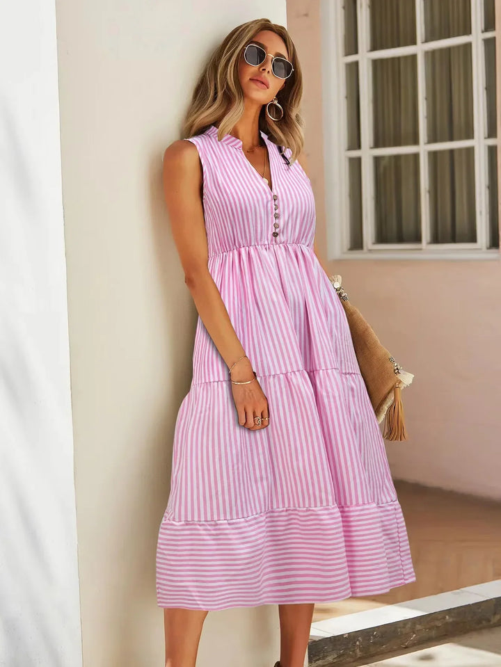 Striped tiered sleeveless midi dress for women, embodying relaxed summer fashion.