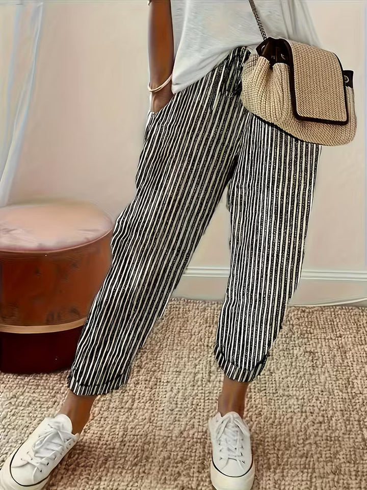 Fashionable women's wide-leg striped pants, designed for ultimate comfort and a relaxed, breezy summer look.