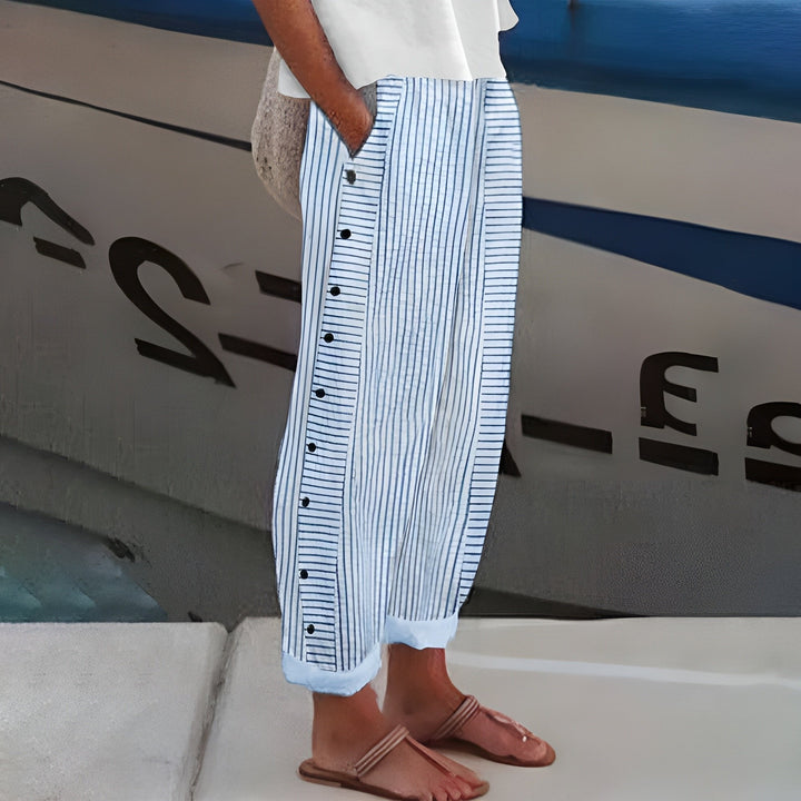 Women's striped wide leg trousers with high waist and decorative side buttons, perfect for chic casual wear.