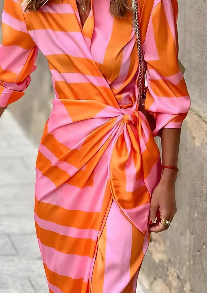 Versatile women's striped midi wrap dress, offering comfort and style for every occasion.